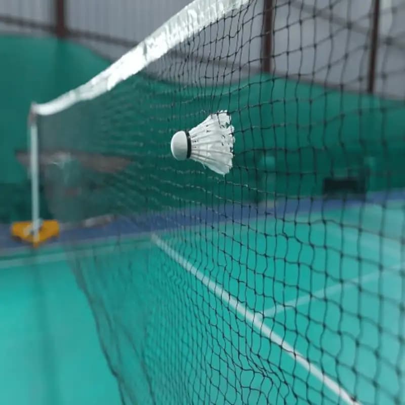 Garware Sportiva Badminton Net installed on an indoor court for practice and match play